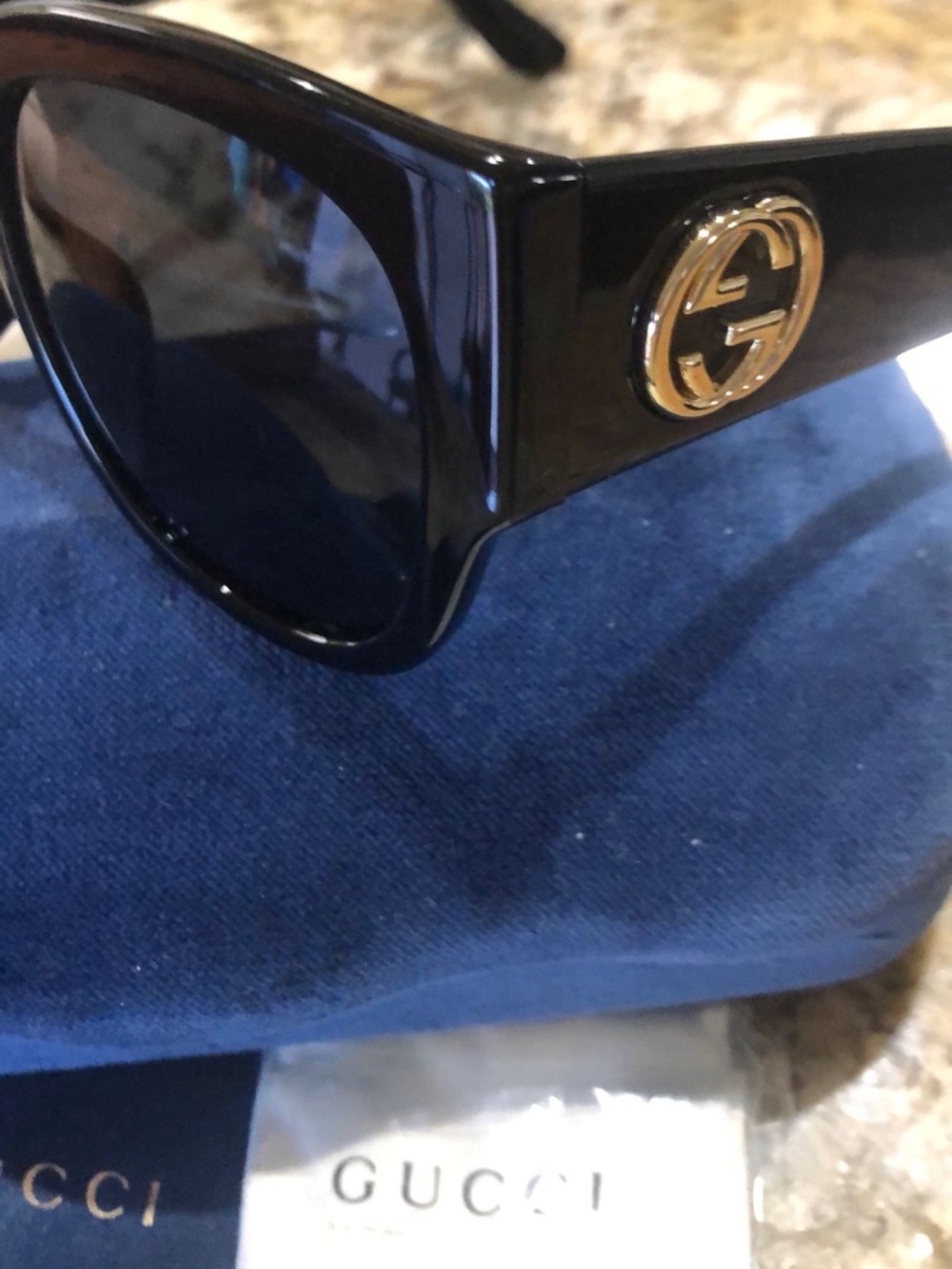 Gucci Black Sunglasses with Gold Detailing